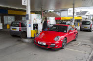 Porsche 911 and Fiat Panda at petrol station