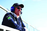 BTCC Peter Riches standing wearing headset