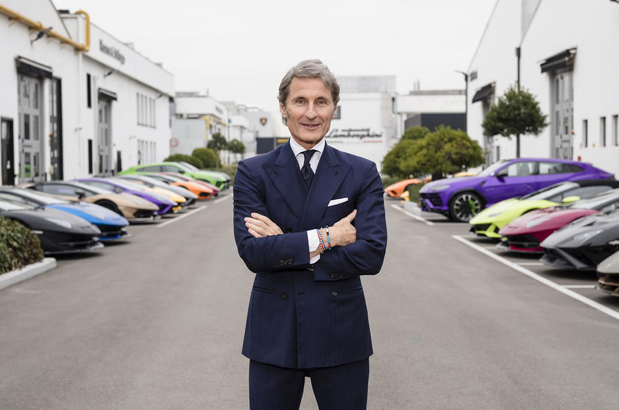 Stephan Winkelmann stood in front of a series of Lamborghinis