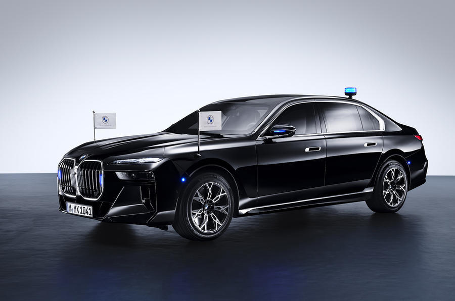 BMW 7 Series Protection front quarter with BMW roundel flags and blue lights