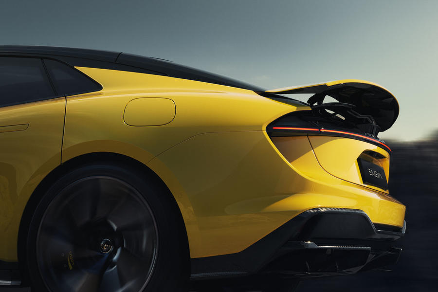 2024 Lotus Emeya in yellow with driving rear spoiler raised