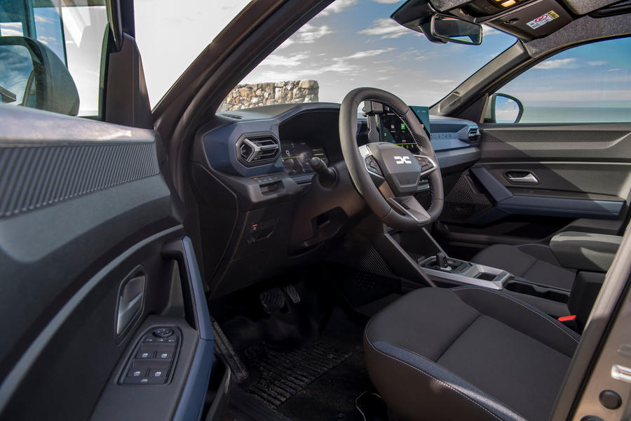Dacia Duster interior viewed through driver's-side door