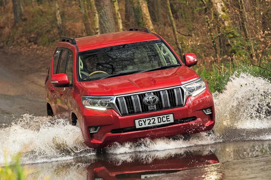 Toyota Land Cruiser driving through big puddle