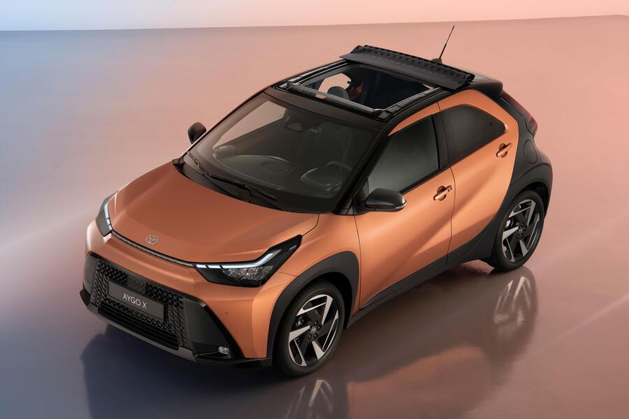 2026 Toyota Aygo X front quarter static, with the cloth roof open